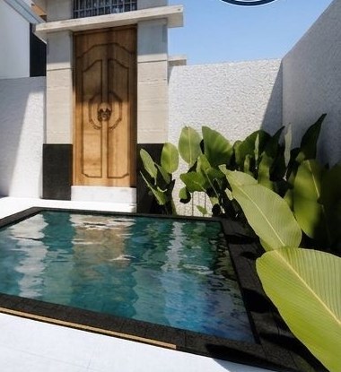Villa exterior with private pool and timber entrance door