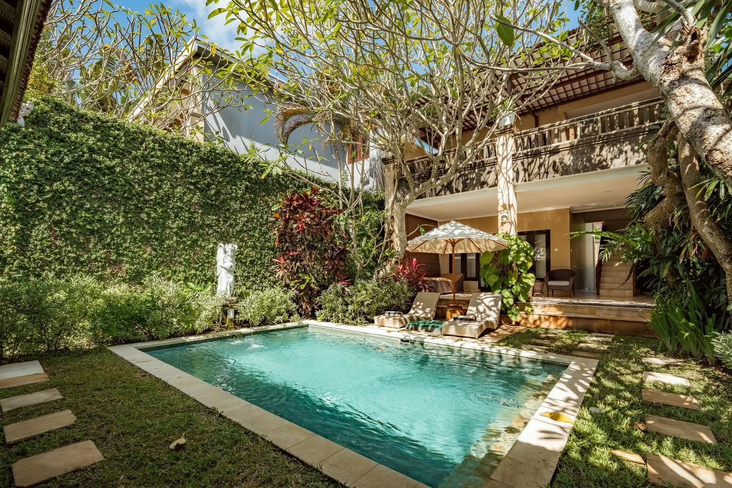 Private pool framed by tropical gardens