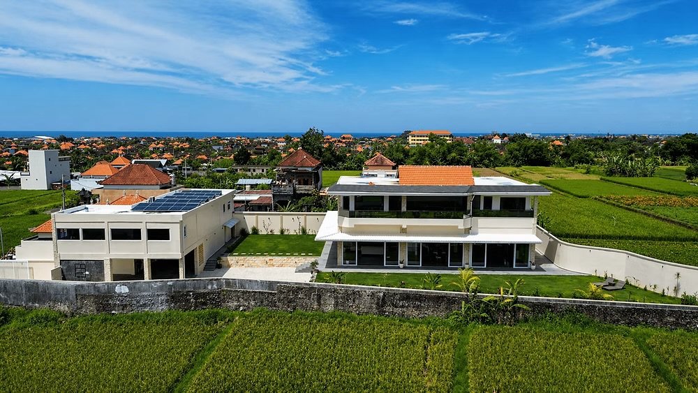 Aerial view of Ketewel villa compound with rice fields and coastline