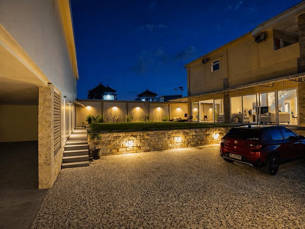 Villa driveway and garden terrace at night